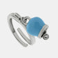 Anello in Metallo con campanella portafortuna pendente color azzurro, impreziosita da punto luce
